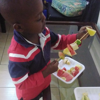 Jayden-Making mshikaki fruit salad.jpg